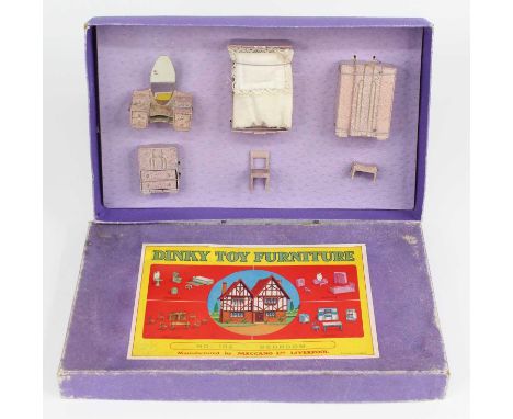 Dinky Toys Pre War No.102 Bedroom set in box, Consists of bed, wardrobe, dressing table, cupboard, chair and foot stool. All 