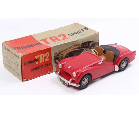 Victory Industries 1/18th scale plastic model of a Triumph TR2 Sports Car, red body, with brown seats, missing one windscreen