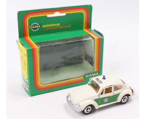 A Mini Gama No. 833 Volkswagen 1302 Beetle Police Car comprising a white body, with green side panels, a tan interior, silver