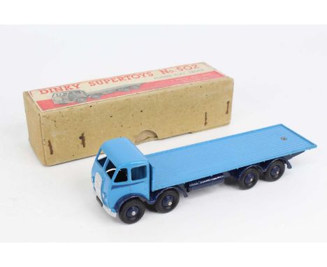 Dinky Toys No. 502 Foden flat truck comprising of first type light blue cab and back with dark blue chassis and side flash, f