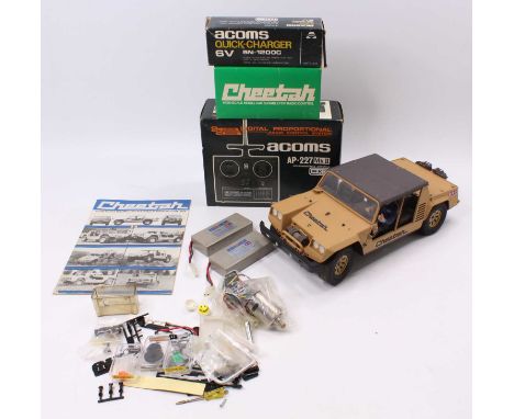 A Tamiya 1/12 scale kit built model of a Cheetah off-road 4x4 vehicle complete with Acoms control unit, quantity of Cheetah s