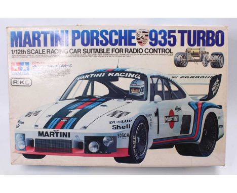 A Tamiya No. RA1202 1/12th scale Martini Porsche 935 Turbo, suitable for radio control adaptation, the kit appears to be comp