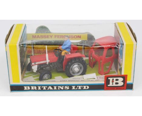 Britains No. 9529 Massey Ferguson 135 tractor with removable cab and muldozer adapter, finished in red with silver plastic hu