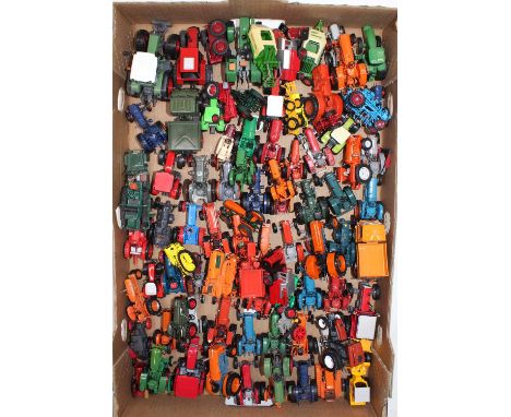 A tray containing Hachette Universal Hobbies tractors and farming related diecasts, with specific examples including a Massey