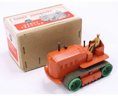 Dinky Toys No. 563 Heavy Tractor comprising orange body, with tan driver and green tracks, housed in the original buff colour