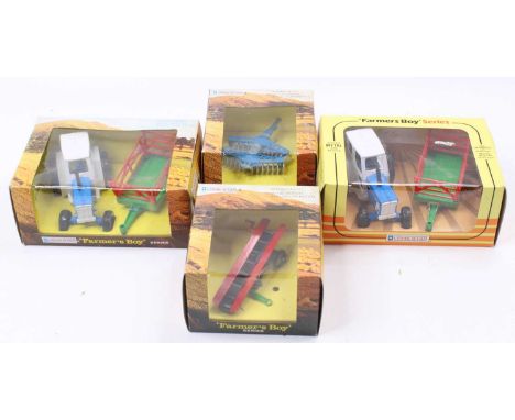Lone Star Farmers Boy Series boxed group of 4 comprising 2x No. 1702 Tractor and Hay Cart, No. 1712 Disc Harrow, and No. 1714