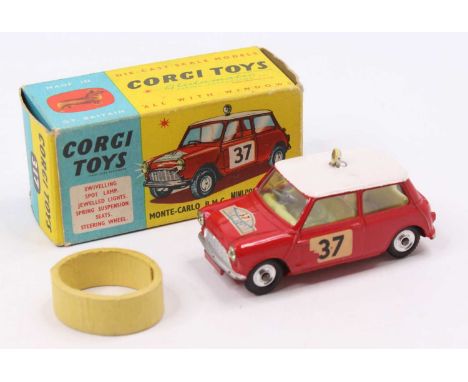 Corgi Toys No.317 B.M.C Mini Cooper with red body and white roof, fitted with yellow interior, spun hubs, jewelled headlights