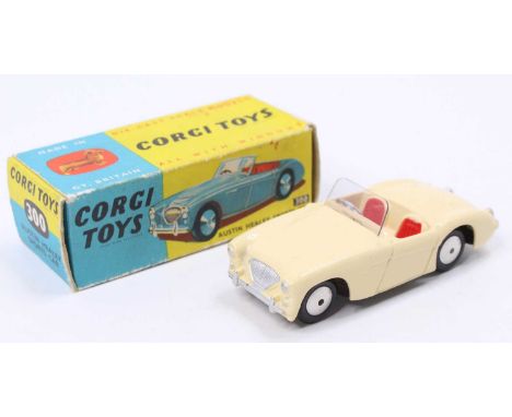 Corgi Toys No. 300 Austin Healey sports car, comprising of cream body with red seats and windscreen, complete with flat spun 