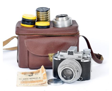 Kodak Medalist II 6x9 Rangefinder Camera. With Ektar f3.5 100mm lens (condition 5F). Plus filters and close-up lenses, all in