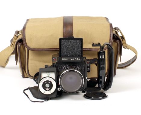 Mamiya M645J Medium Format Camera. With 80mm f2.8 lens and aftermarket grip (condition 5F). With meter and gadget bag.