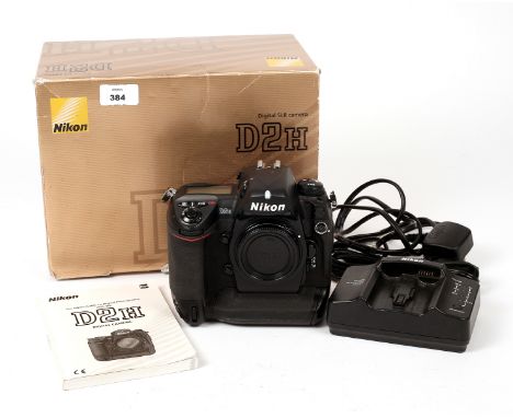 Nikon D2H Digital SLR Camera Body. #2033281 (condition 5E) with battery, charger, cables etc, in makers box. Shutter count no