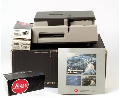 Leica Pradovit 153DU 35mm Slide Projector. With 90mm f2.8 lens, remote, instructions etc. In makers box. Also a box of 5 extr