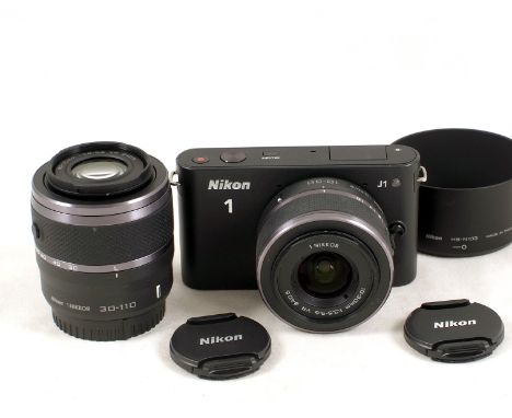 ComprisingNikon J1 camera body #61020-402 with 1 Nikkor 10-30mm f3.5-5.6 VR lens and a 1 Nikkor 30-110mm f3.8-5.6 VR lens #12