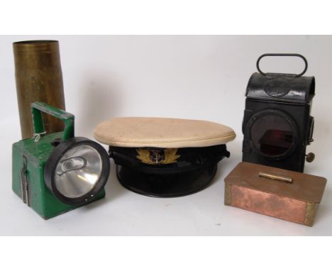 MILITARIA: A collection of assorted military and similar items to include an admiralty peaked cap, trench art shell from 1980