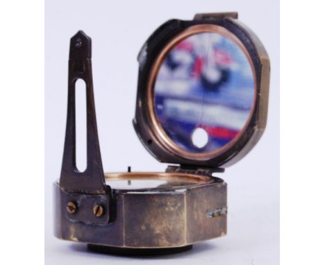 COMPASS: A vintage brass cased Stanley Of London military related compass. 8cm diameter. With opening top. 