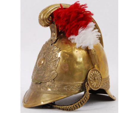 FIREMAN'S HELMET: An antique French Fireman's helmet, with emblem to front ' Devouement Pompiers De St Ulphase '. complete wi