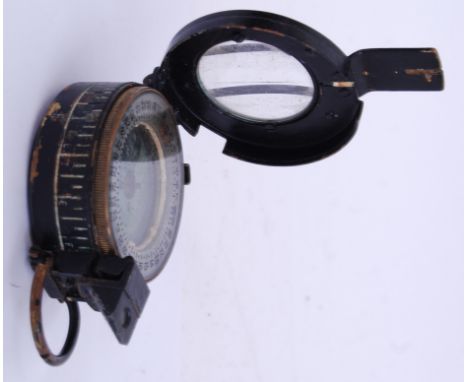 WWII COMPASS: A WWII Second World War era military issued TG&Co ' Mk III ' compass. Embossed makers name to underside. Openin