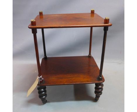 A 19th century rosewood two tier lamp table raised on turned legs and castors. H-52 W-39 D-33cm 
