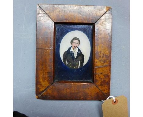 A late 19th / early 20th century reverse painted glass portrait of a gentleman, 8 x 7cm 