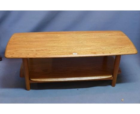 An Ercol elm two tier coffee table. H-46 W-128 D-56 cm 