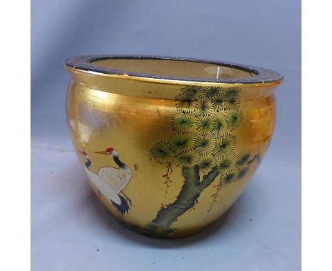 A 20th century Chinese ceramic jardiniere decorated with cranes on a gilt painted ground. H-36 diameter- 46cm 