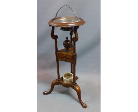 A Georgian style mahogany wash stand with trophy finial over two drawers raised tripod legs. H-79cm 