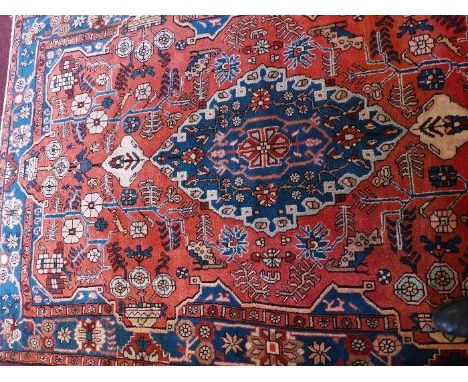A fine North West Persian Nahawand rug,, 242cm x 156cm, central jade diamond medallion on a terracotta field within stylised 