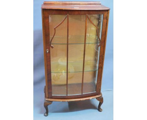 A 1930's burr walnut bow fronted display cabinet raised on cabriole legs. H-116 W-60 D-29cm 