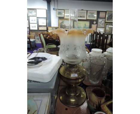 A 19th century brass frame oil lamp having later fluted shadeCONDITION REPORT:DENT TO BASE, SHADE IN GOOD CONDITION