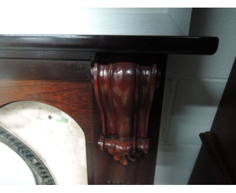 A mahogany effect fire surround