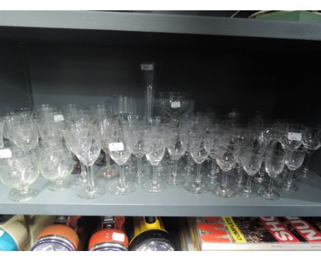 A selection of clear cut crystal glass wares including wine brandy and spirit