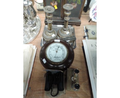 A port hole barometer and set of Ashai binoculars