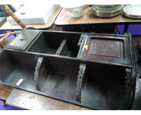 An early 20th century dark mahogany wall shelf of Chinese design having inscised animal motif decorationCONDITION REPORT - FR