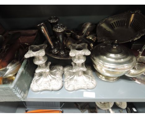 A selection of silver plate including candlesticks, loose and cased flatware, teapot etc