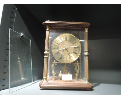 A glass bodied mantle clock by Kundo