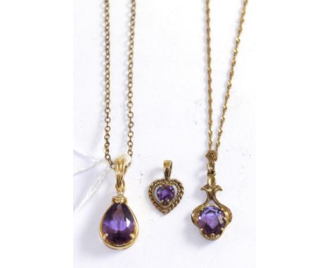 Two 9ct gold amethyst pendant necklaces and an amethyst heart pendant (3)Gross weight 6.6 grams 