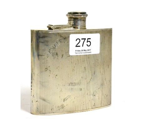 A silver hip flask with bayonet action cover and engraved with engine turned decoration