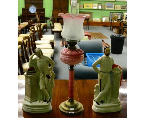 Two large Staffordshire figures; Shakespeare and Garabaldi; and a pink glass and brass oil lamp (3)  