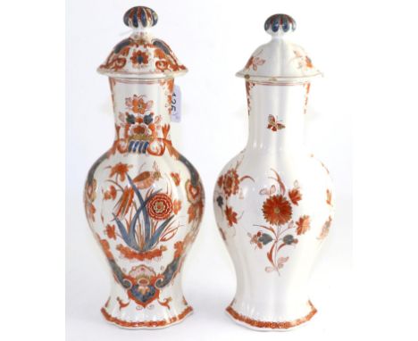 A pair of 19th century Delft vases and covers One vase with minor rim frits and chips. One cover with several rim chips. Othe
