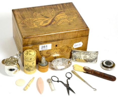 Silver items including a card case, small embossed dish, milk jug, tortoiseshell and silver compact, contained within an inla
