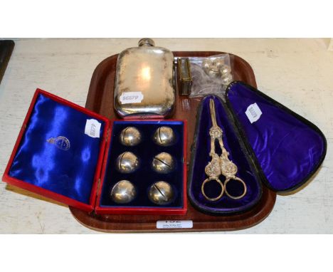 A set of six silver place card holders, Birmingham 1904; together with six plated golf ball examples; a plated hip flask and 