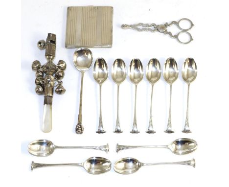 An Art Deco silver compact, Birmingham 1944; an unmarked combination rattle/whistle; a pair of George II style sugar nips 193