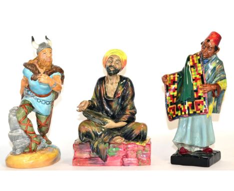 Three Royal Doulton figures Carpet Seller HN1464, Mendieant HN1365 and Viking HN2375