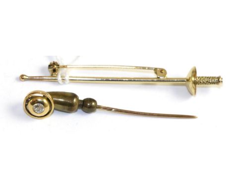 An old cut diamond set stick pin, 0.15 carat approximately and a fencing epee brooch, stamped 'rolled gold'