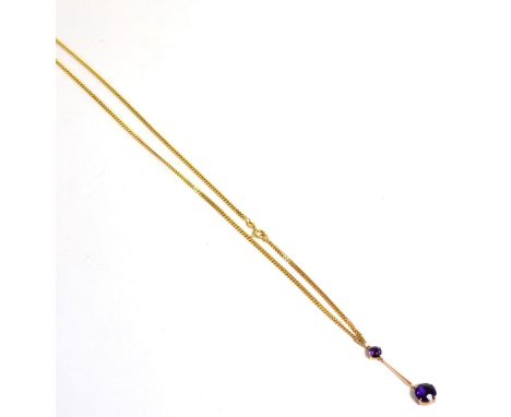 An amethyst necklace, a round cut amethyst suspends a larger round cut amethyst by a yellow tapering bar, on a later 9ct gold