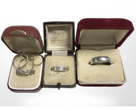 A silver Celtic band ring, a steel ring with engraved script to interior, a Pandora ring and three further rings.