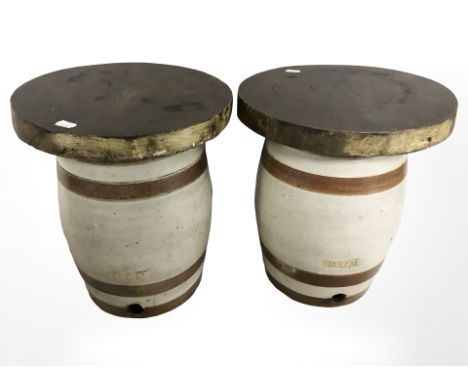 Two 19th century earthenware kegs, marked rum and gin, with later wooden tops, height 35 cm.