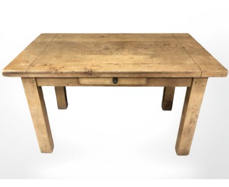 A contemporary oak dining table, length 130 cm and four ladder back chairs with rush seats 