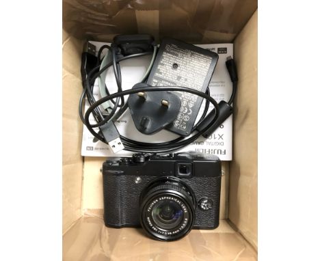 A Fujifilm X-10 camera, with Super EBC F=7.1-28.4mm lens, manual, charger and lead, and a smart watch. (1 box)