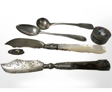 A Georgian silver caddy spoon, further teaspoon, two decorative silver knives, one with carved mother of pearl handle, the ot